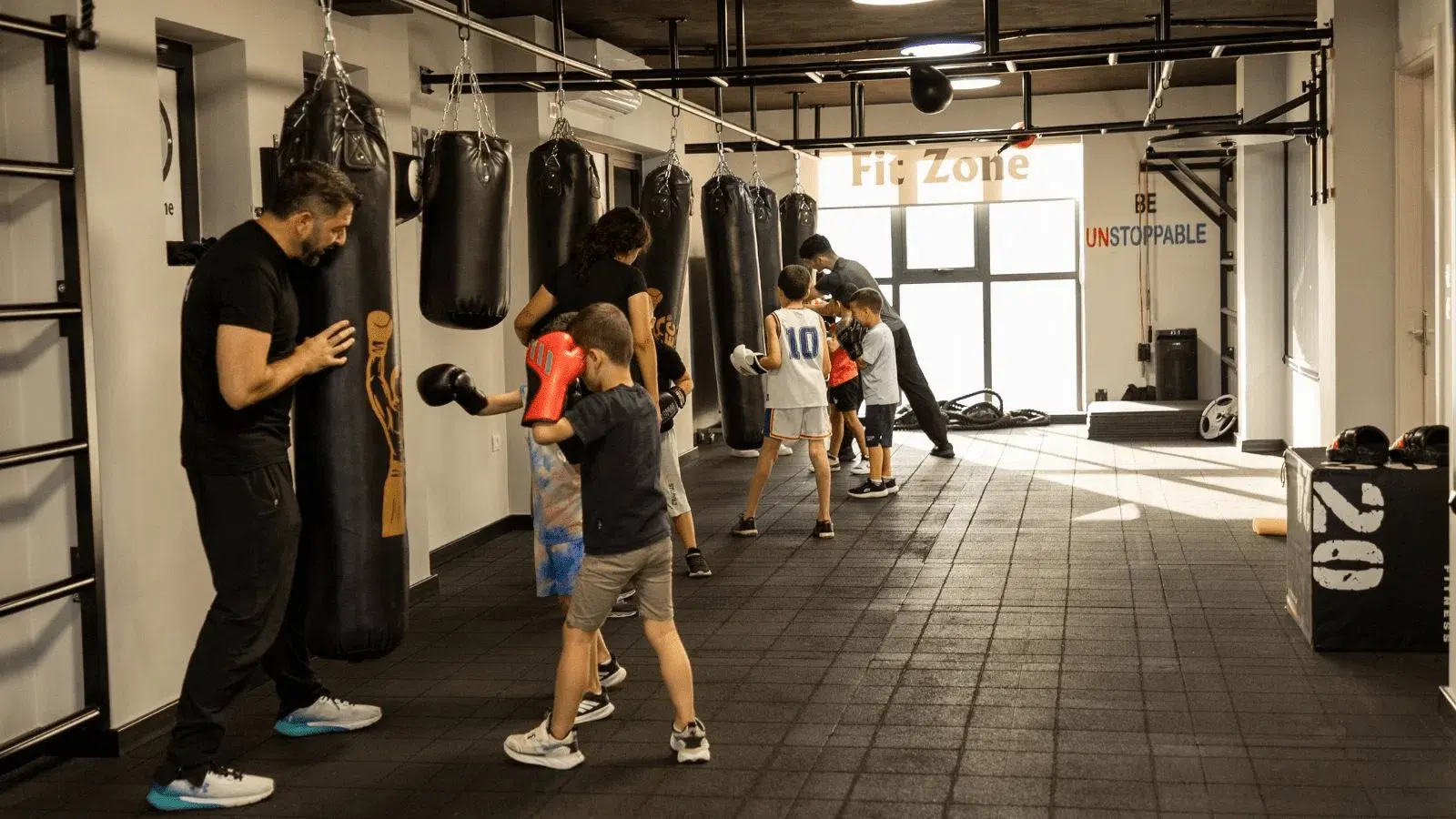 High-energy group fitness class with participants working out together