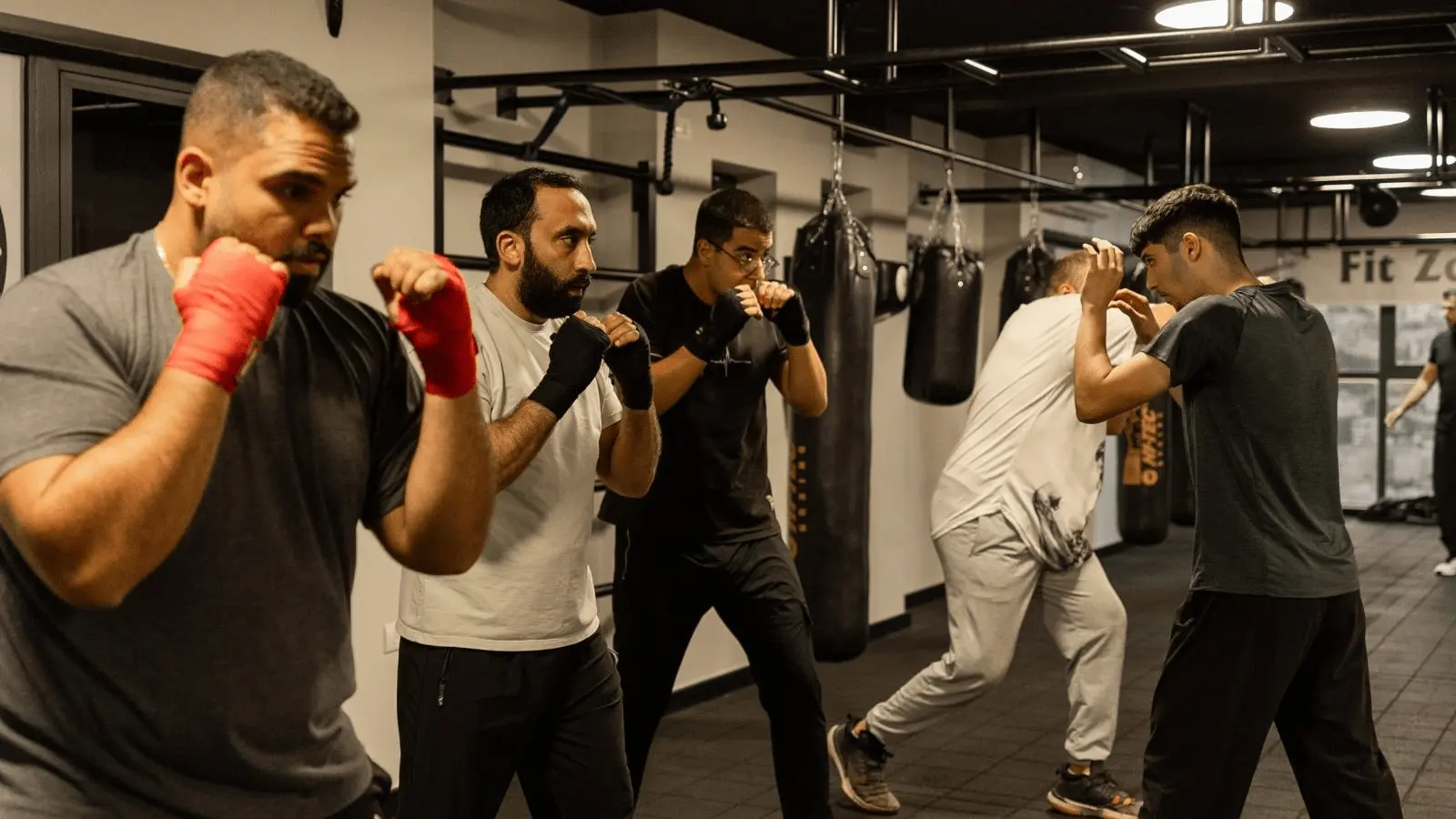 Functional training session with participants performing dynamic full-body exercises